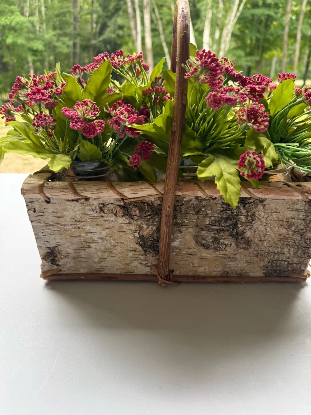 Birch basket mason jars filled with artificial flowers table decor
